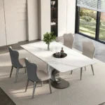 طاولة طعام بقاعدة بتصميم حديث مع كراسي